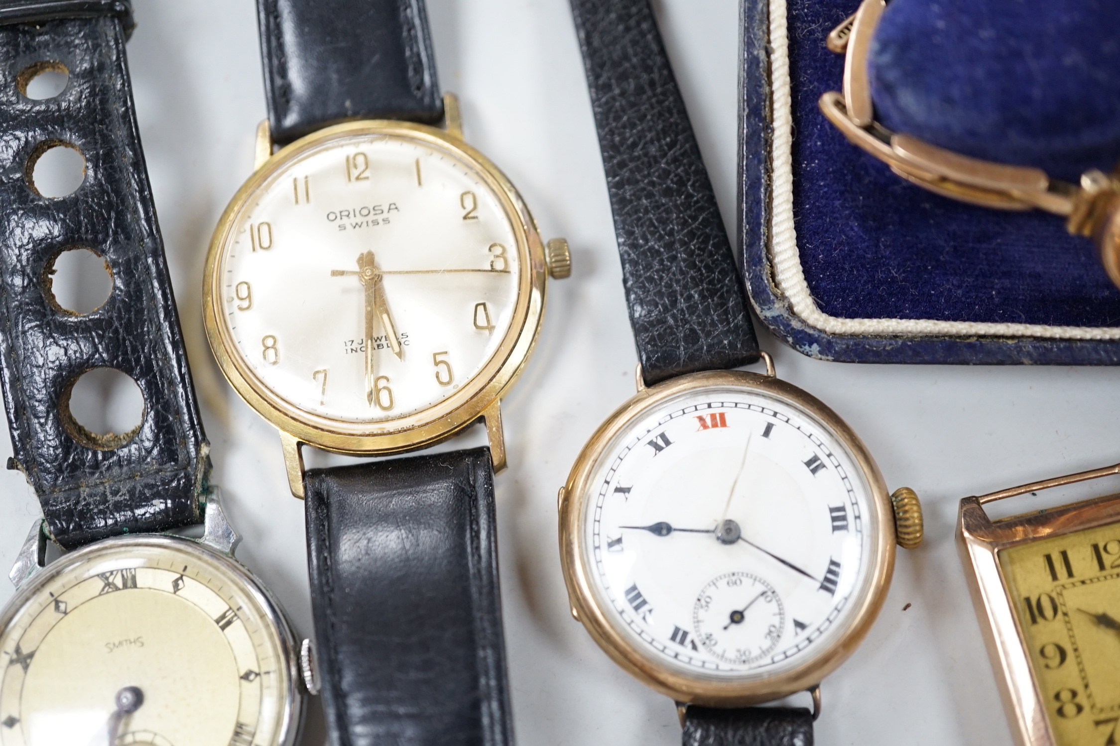 A lady's 1930's 9k J.W. Benson manual wind wrist watch, on a 9ct flexible bracelet, one other gentleman's 9ct gold wrist watch and four other wrist watches.